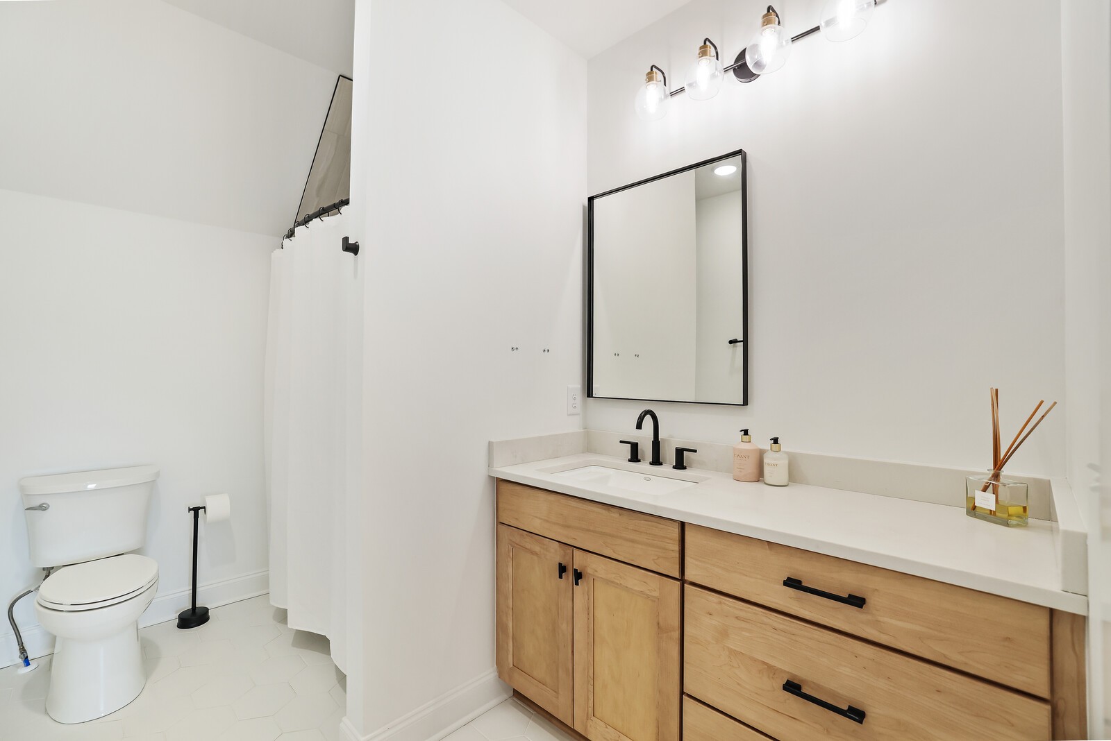 3755 Holmes Gap Road Watertown, TN 37184 - Photo 26 of 71 a bathroom with a toilet sink and mirror