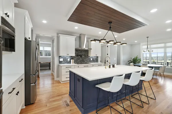 a dining room with furniture and wooden floor