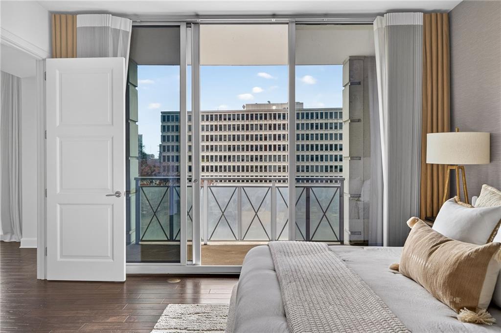 1820 Peachtree Road Northwest, Unit 312 Atlanta, GA 30309 - Photo 14 of 51 a bedroom with a bed and a window