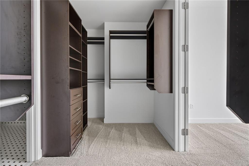 1820 Peachtree Road Northwest, Unit 312 Atlanta, GA 30309 - Photo 27 of 51 a view of walk in closet with empty racks