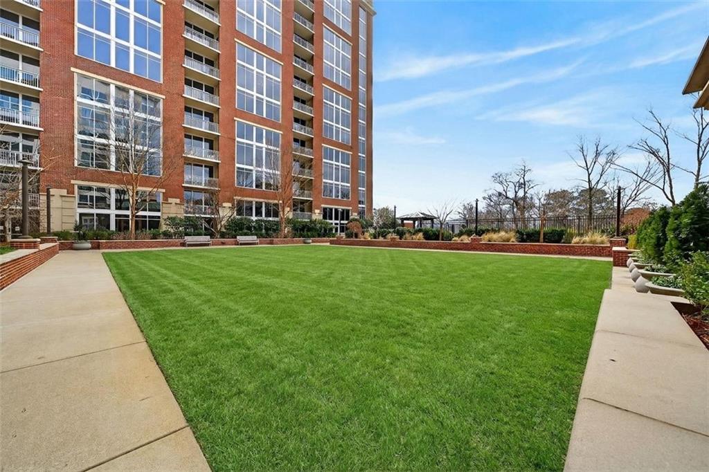 1820 Peachtree Road Northwest, Unit 312 Atlanta, GA 30309 - Photo 39 of 51 front view of a building with a yard