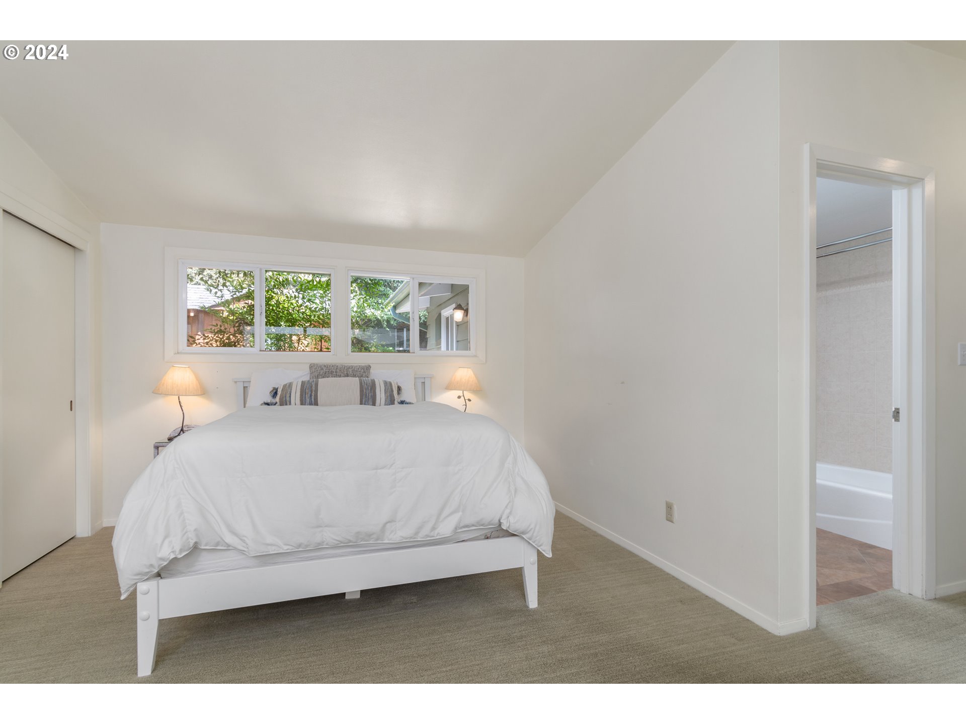3430 View Lane Eugene, OR 97405 - Photo 17 of 48 a bed sitting in a bedroom next to a window