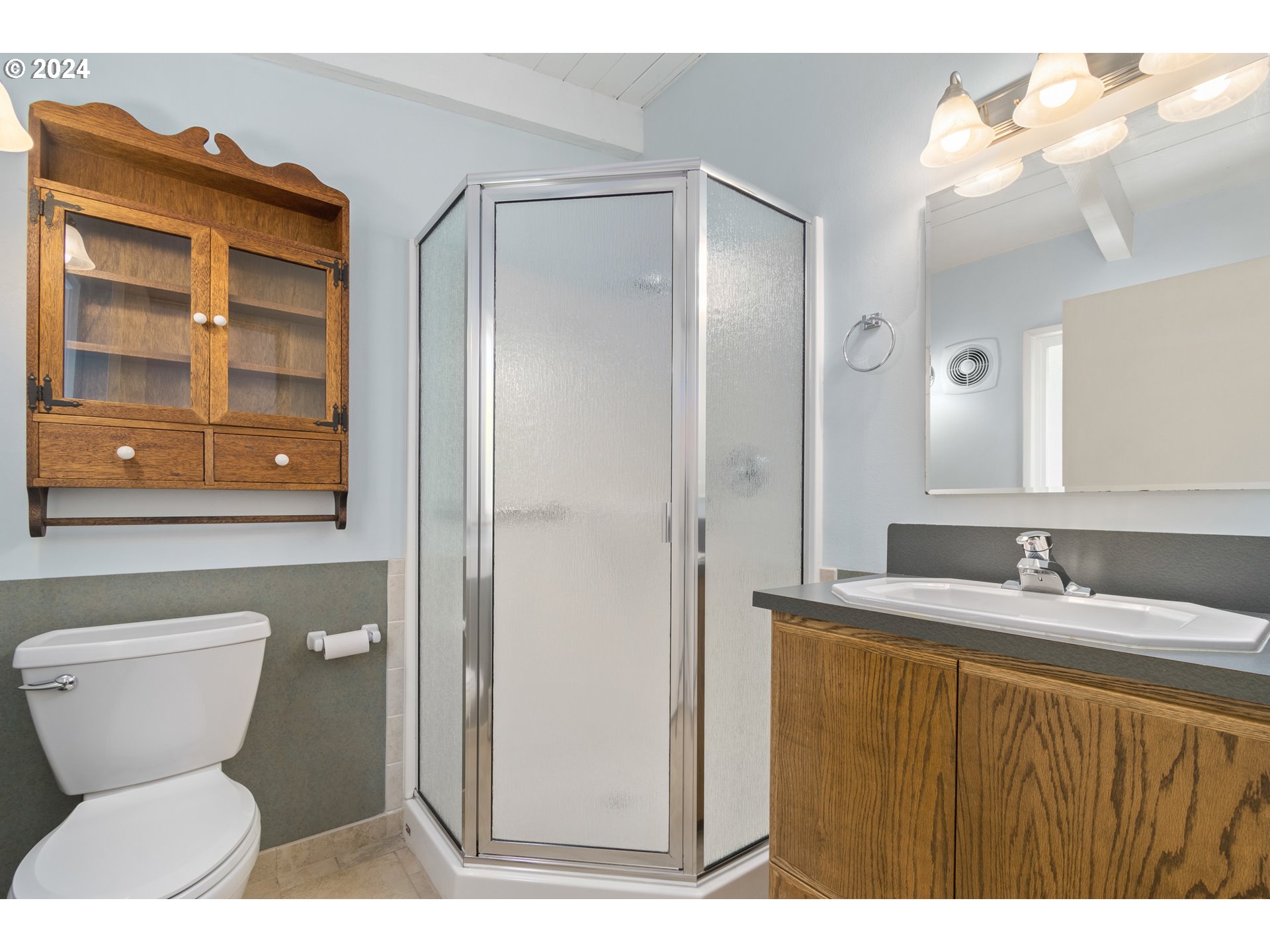 3430 View Lane Eugene, OR 97405 - Photo 24 of 48 a bathroom with a toilet sink and mirror