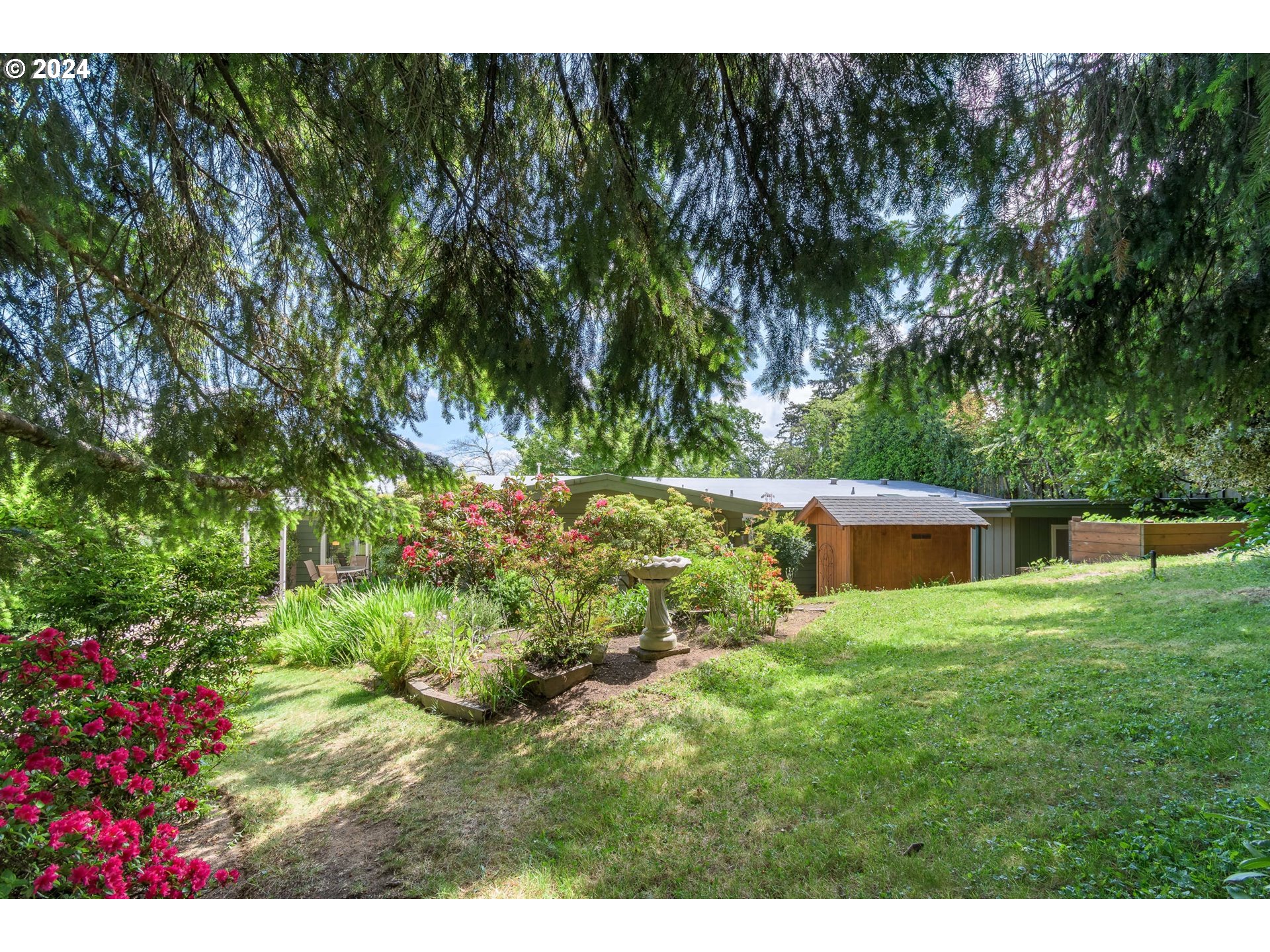 3430 View Lane Eugene, OR 97405 - Photo 36 of 48 a balcony with floor to ceiling window and a tree