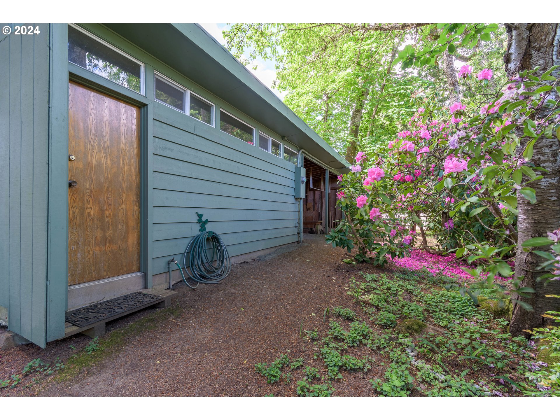 3430 View Lane Eugene, OR 97405 - Photo 38 of 48 a backyard of a house with lots of green space