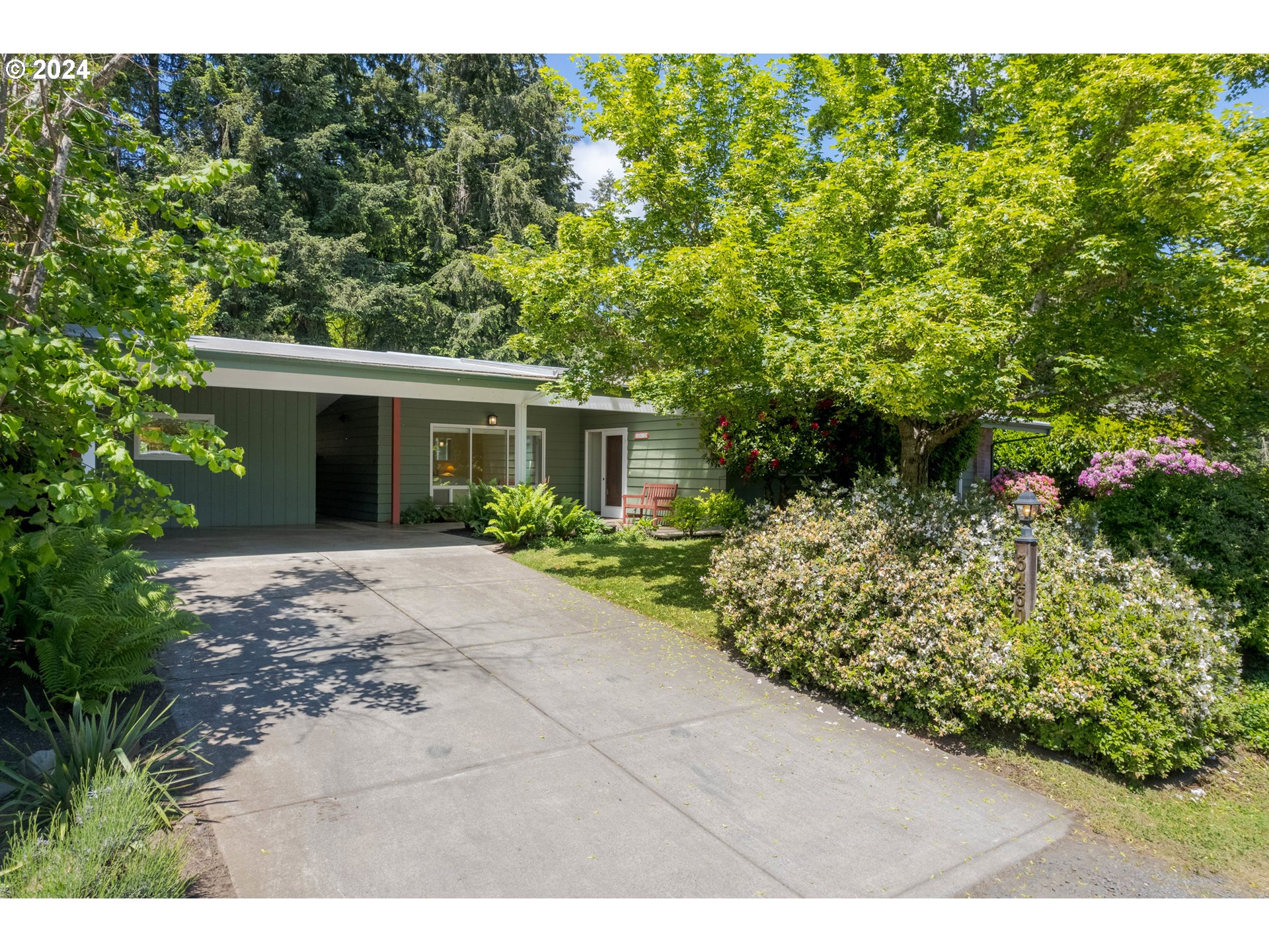3430 View Lane Eugene, OR 97405 - Photo 45 of 48 a view of a house with a yard and garden