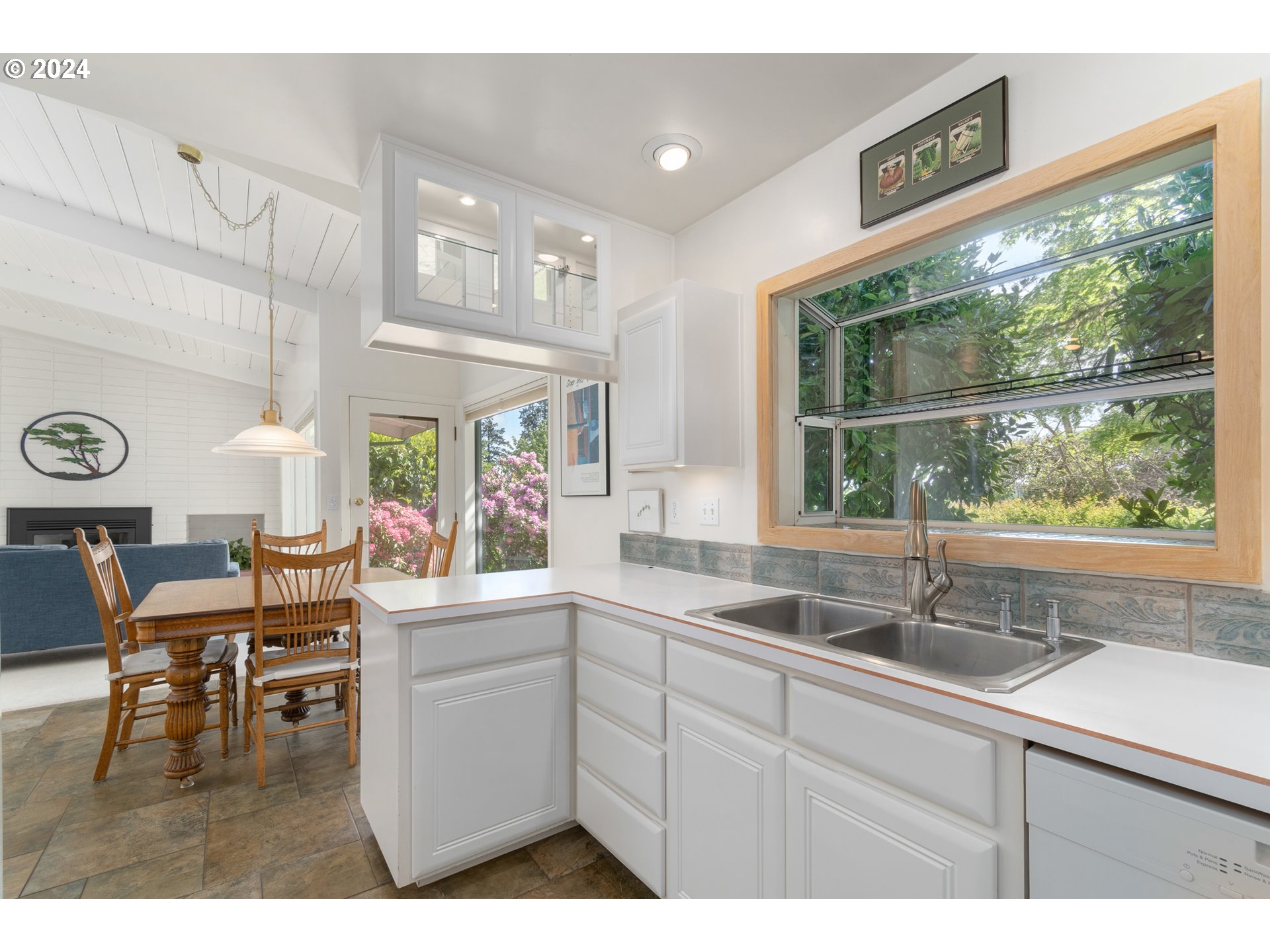 3430 View Lane Eugene, OR 97405 - Photo 9 of 48 a kitchen with a sink cabinets and wooden floor
