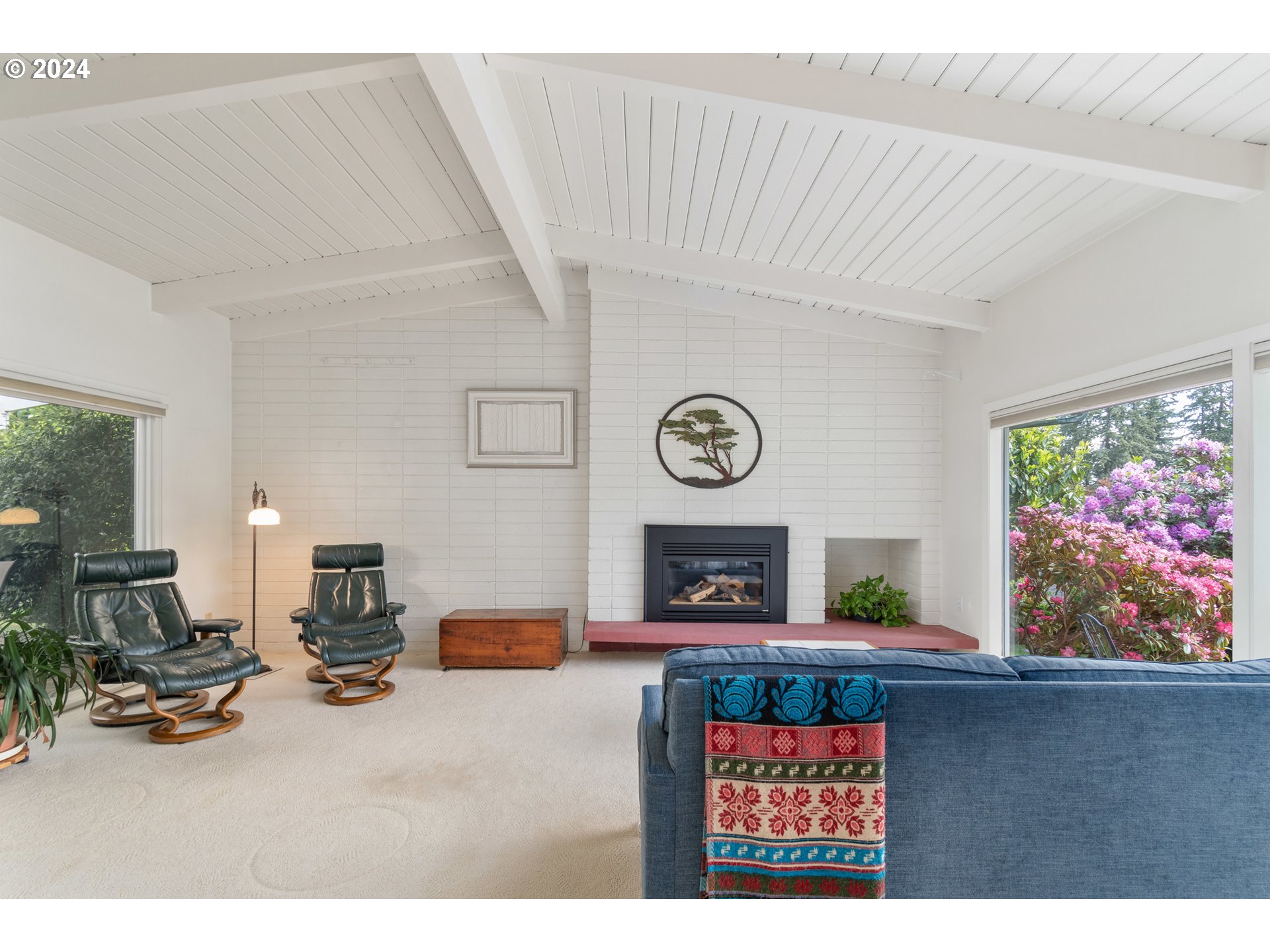 3430 View Lane Eugene, OR 97405 - Photo 10 of 48 a living room with furniture and a flat screen tv