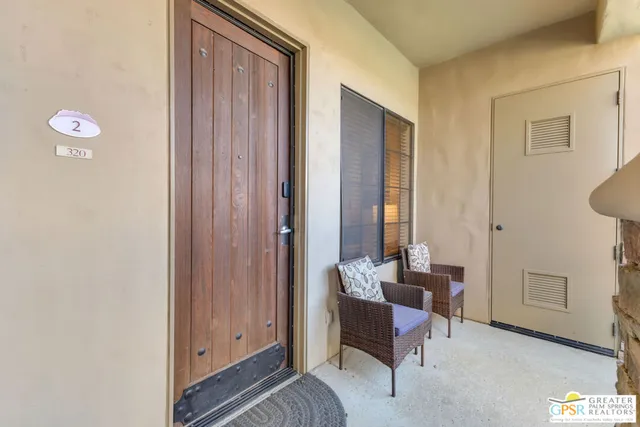 a view of a livingroom with furniture and windows