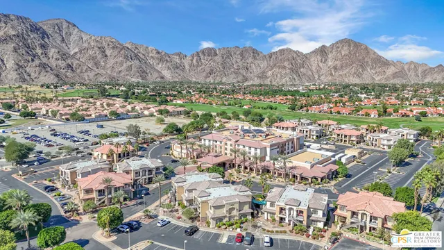 an aerial view of residential houses and outdoor space