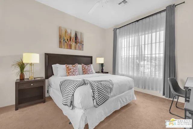 a bedroom with a bed and window