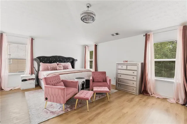 a view of balcony with wooden floor and fence