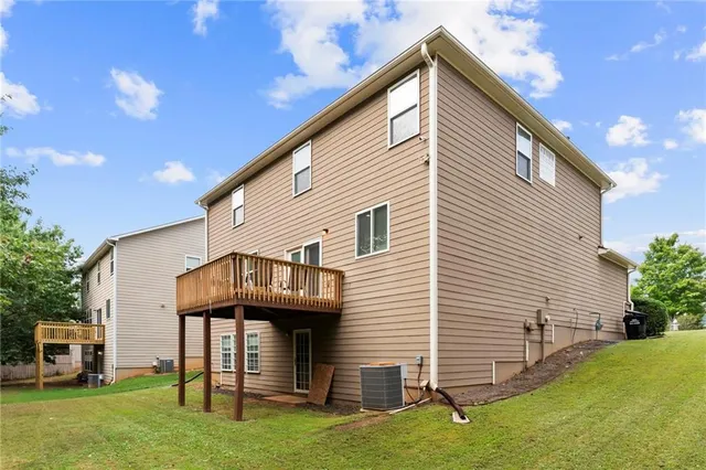 a living room with furniture a wooden floor and a window