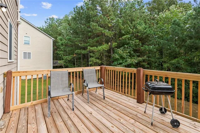 an aerial view of a house with a yard and lake view