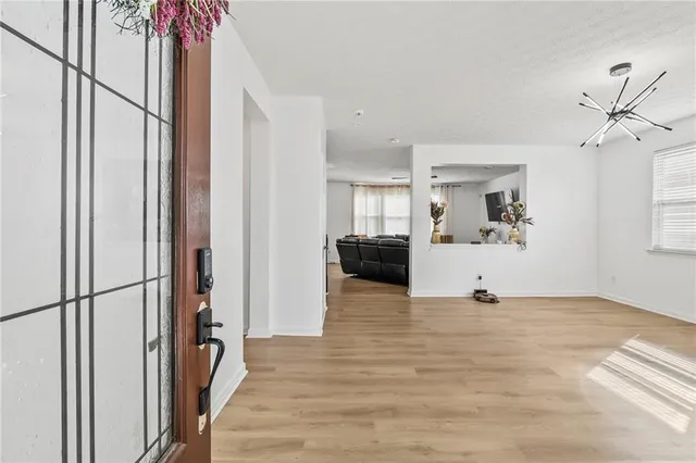a view of a kitchen with a sink and a window