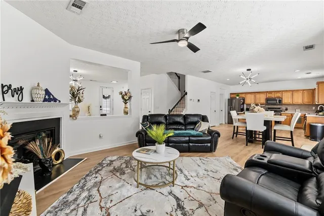 a kitchen with a stove a sink and a refrigerator
