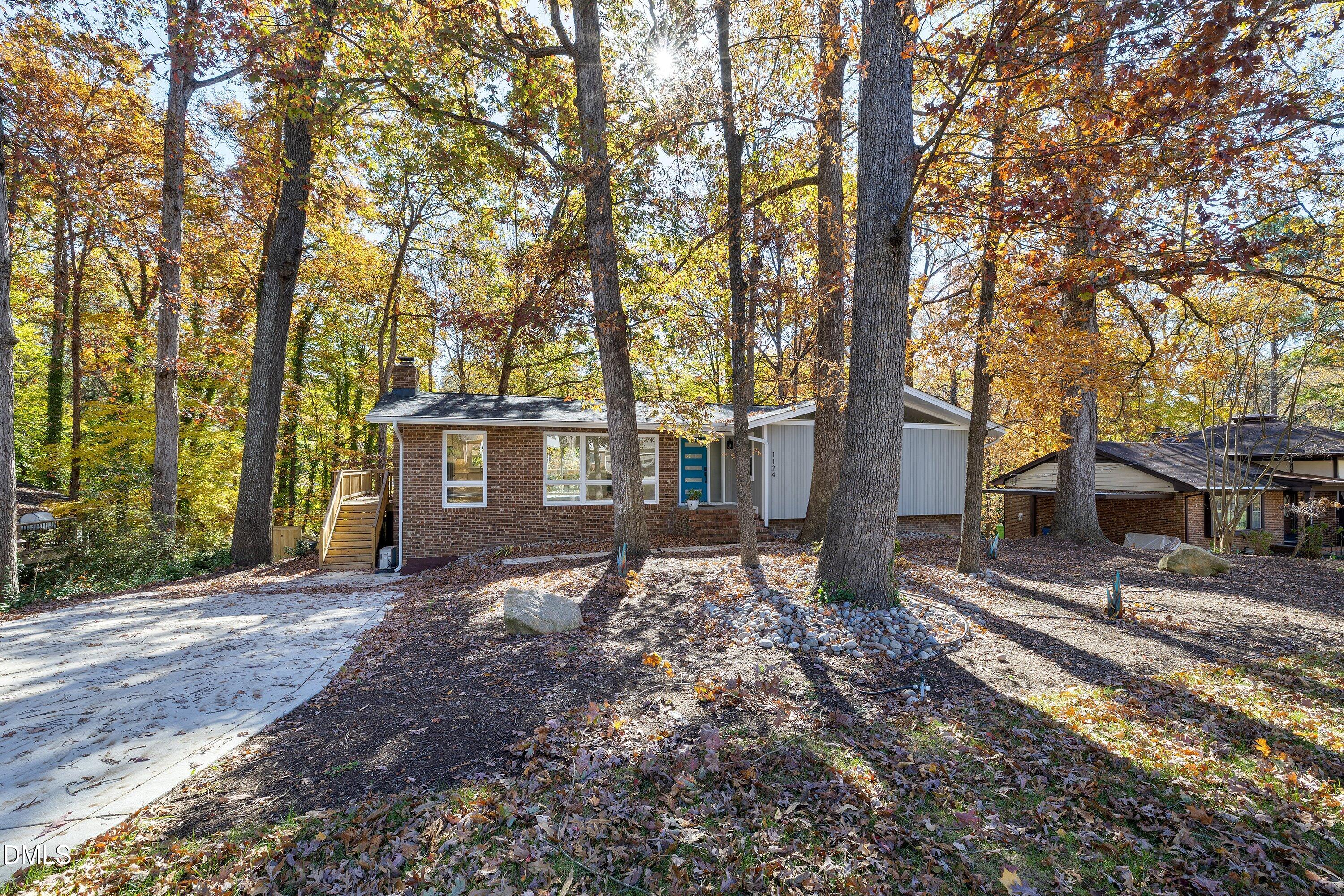 1124 Hardimont Road Raleigh, NC 27609 - Photo 6 of 34 a view of a house with large trees