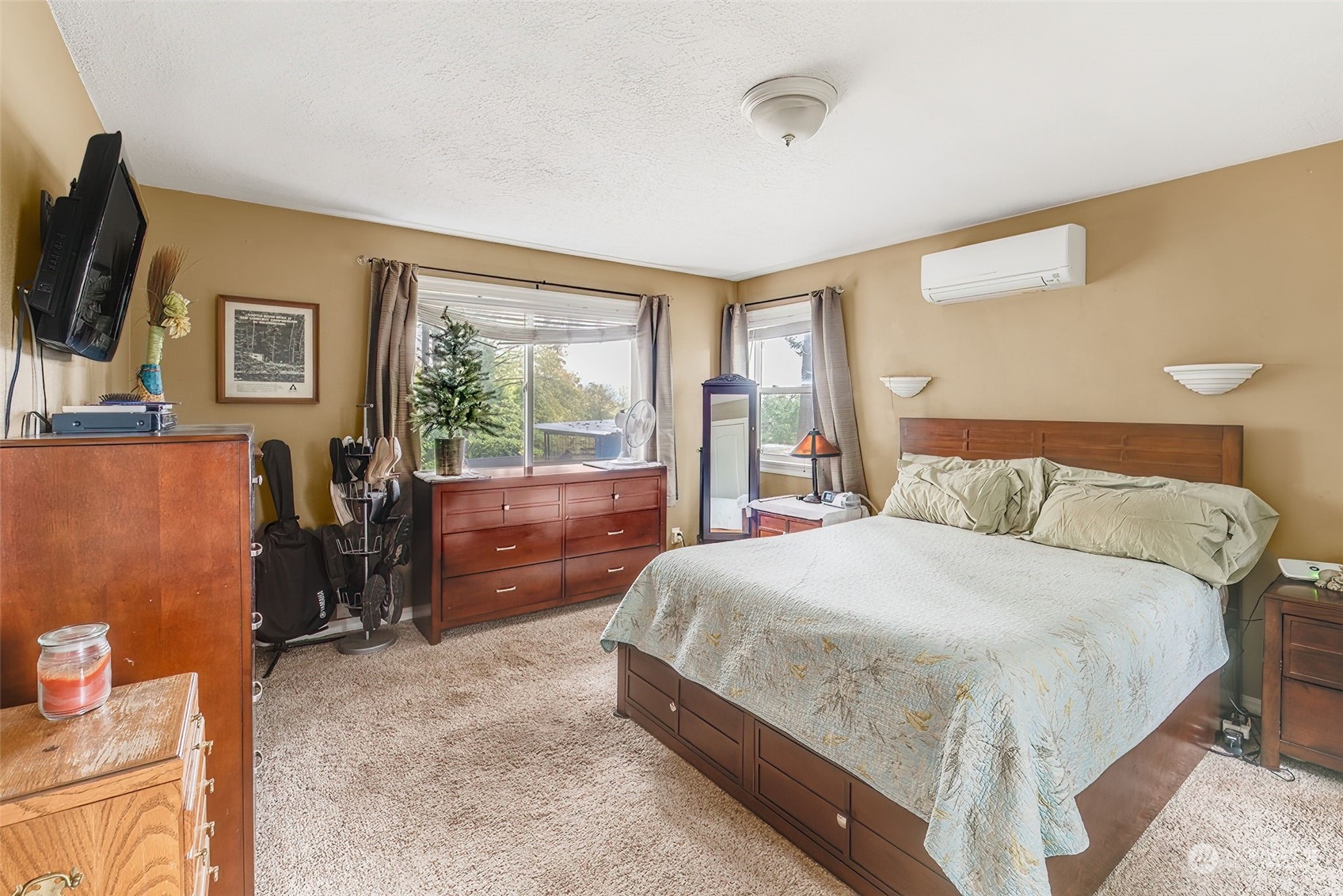 2320 West Castleman Street Longview, WA 98632 - Photo 17 of 36 a bedroom with a bed flat screen tv and windows