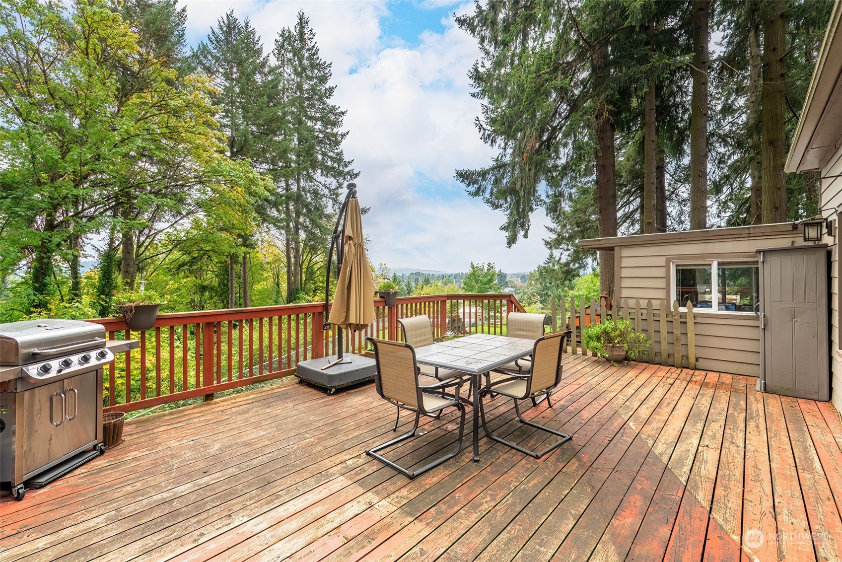 2320 West Castleman Street Longview, WA 98632 - Photo 25 of 36 a view of a roof deck with table and chairs and wooden floor