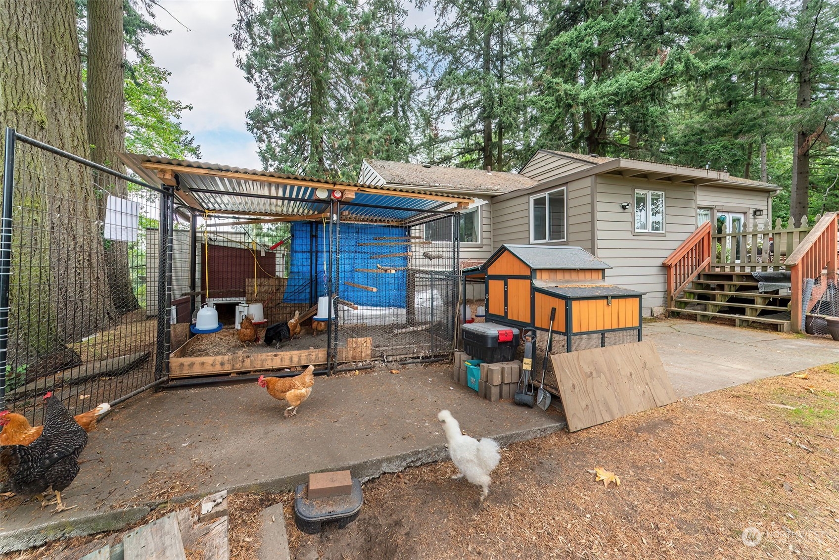 2320 West Castleman Street Longview, WA 98632 - Photo 28 of 36 a view of a patio with couches chairs and a wooden floor