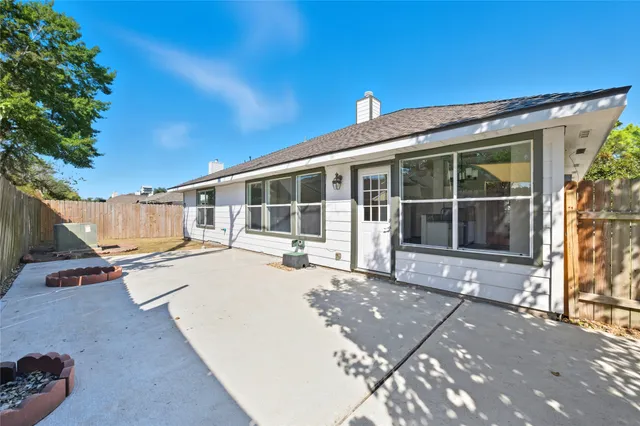 a view of a backyard of the house