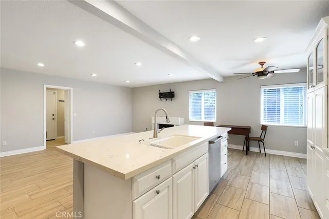 a large white kitchen with a window