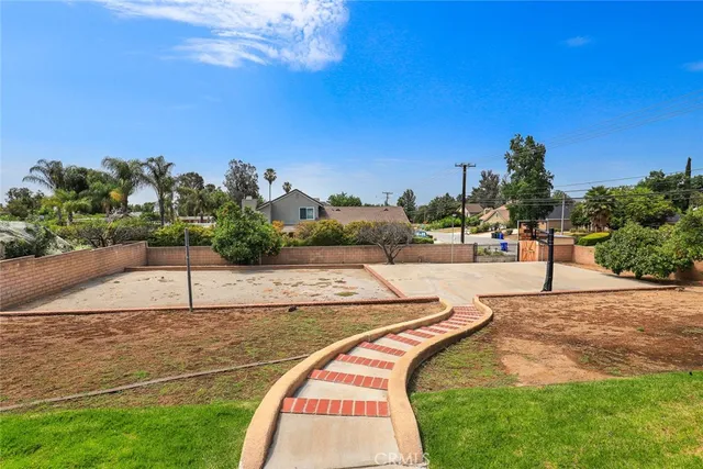 a view of a swimming pool with a yard