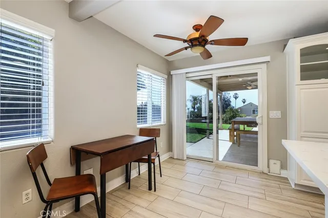 a workspace with wooden floor and a window