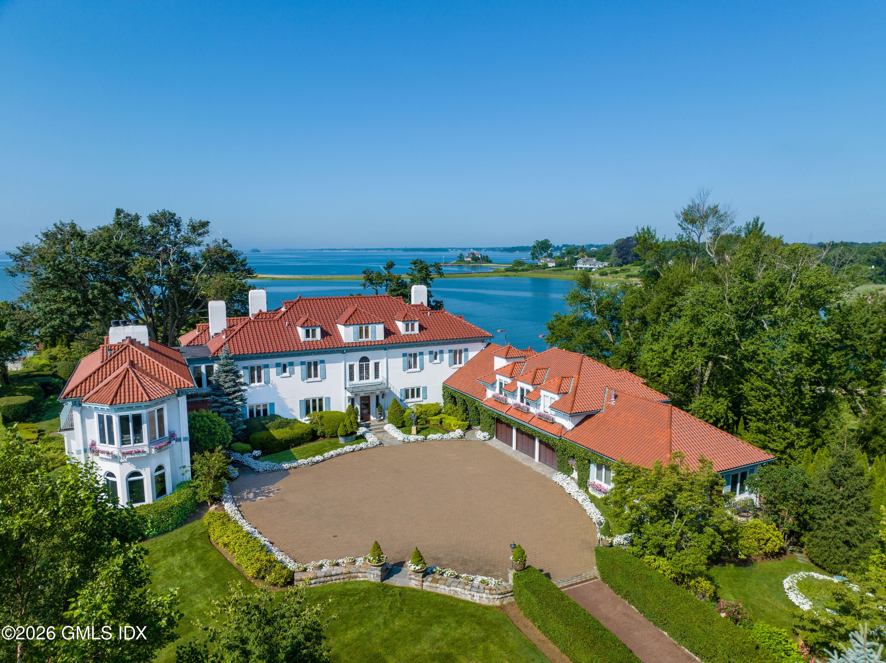 an aerial view of a house with swimming pool and outdoor space