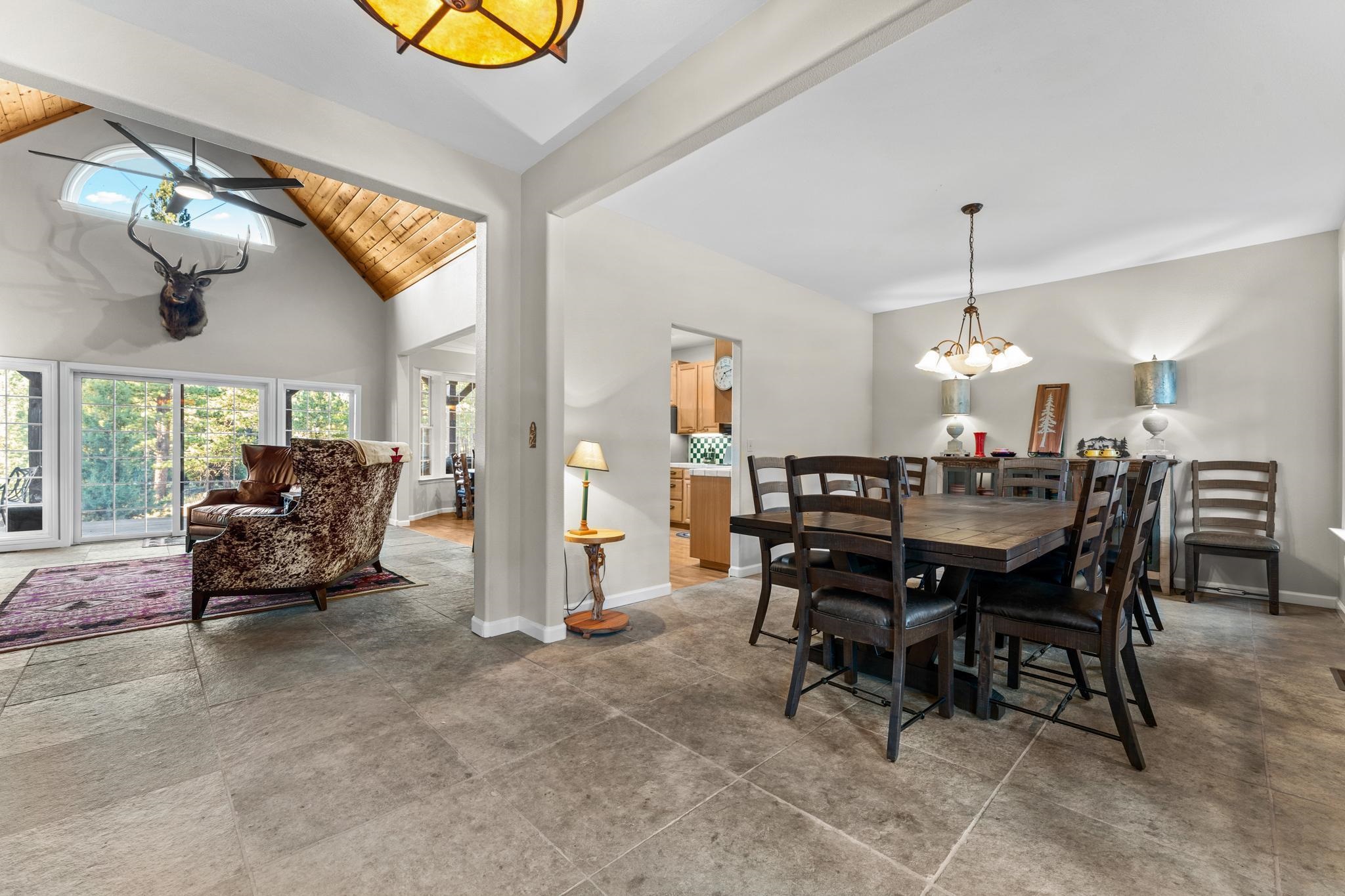 1341 Valley Ranch Drive Clio, CA 96106 - Photo 10 of 50 a view of a dining room with furniture and a chandelier