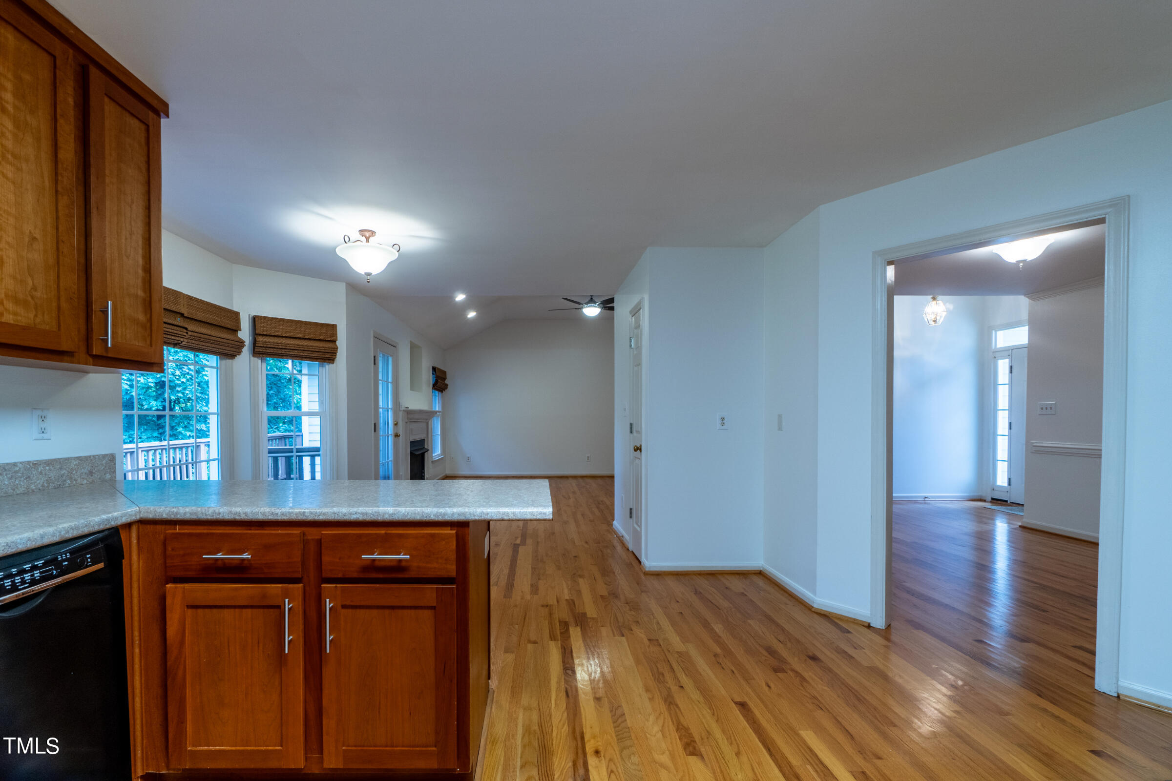 2 Summer Ridge Durham, NC 27712 - Photo 12 of 29 a kitchen with kitchen island granite countertop wooden cabinets and a granite counter tops