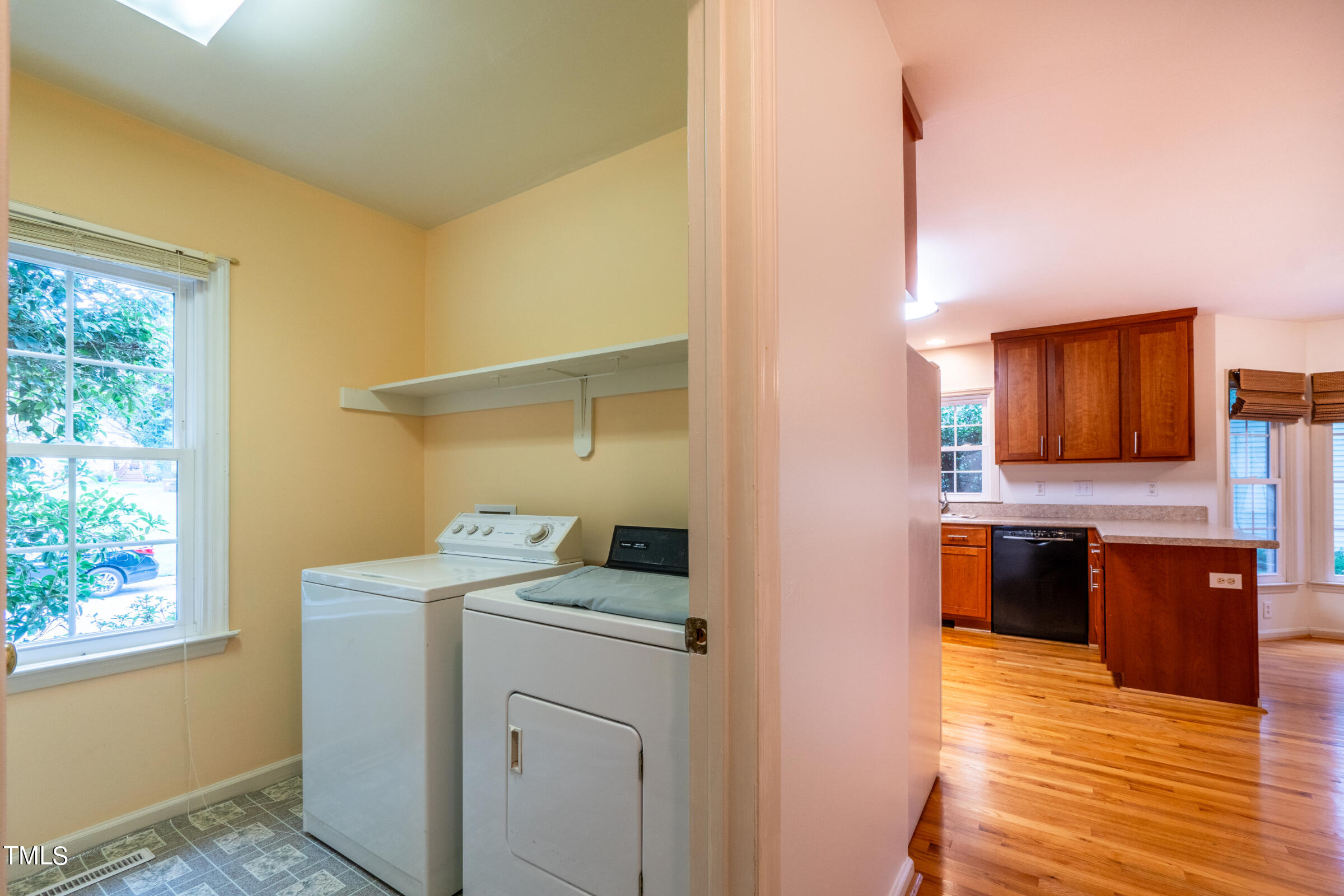 2 Summer Ridge Durham, NC 27712 - Photo 13 of 29 a view of a kitchen with a stove wooden cabinets and a refrigerator