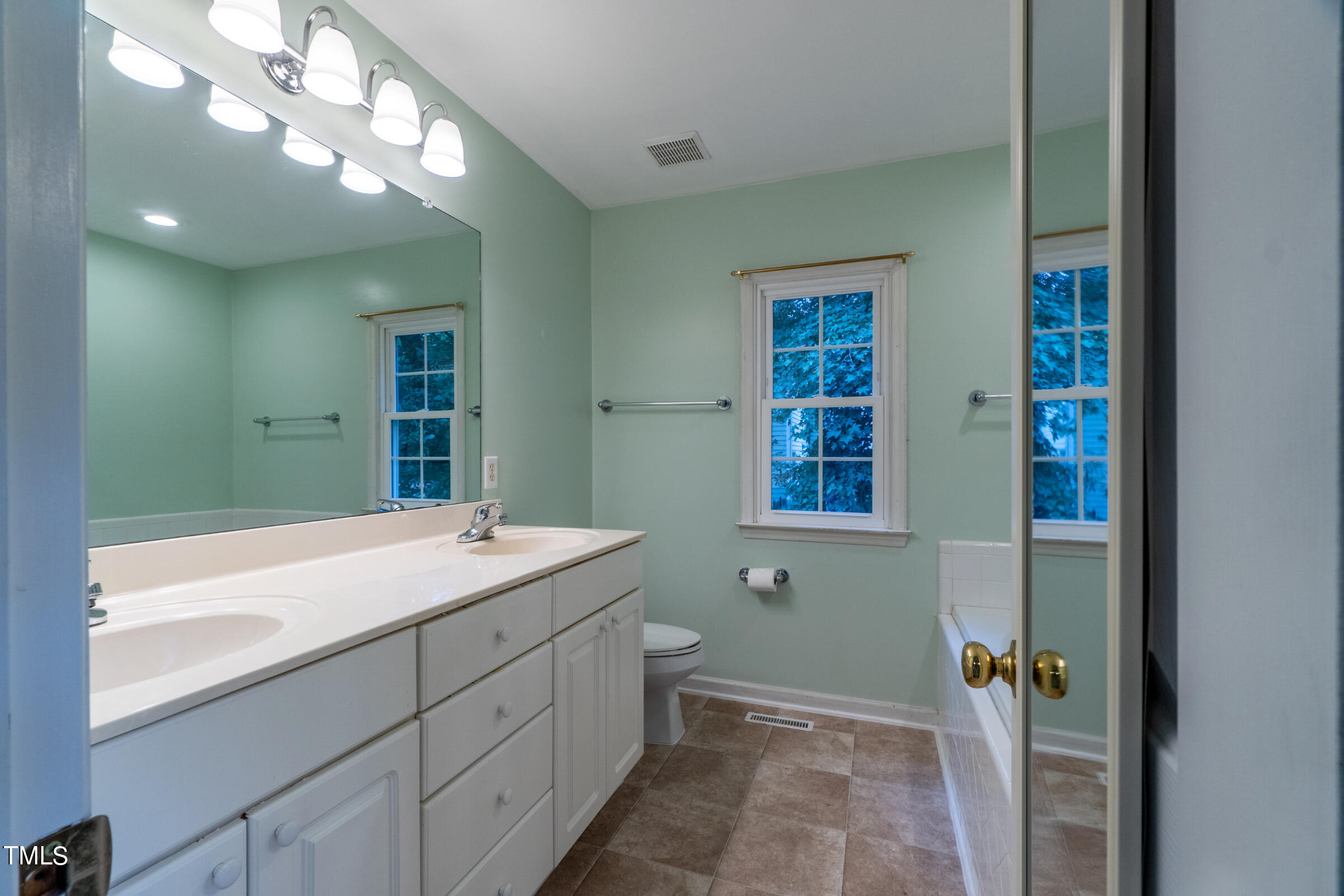 2 Summer Ridge Durham, NC 27712 - Photo 17 of 29 a bathroom with a sink and a mirror