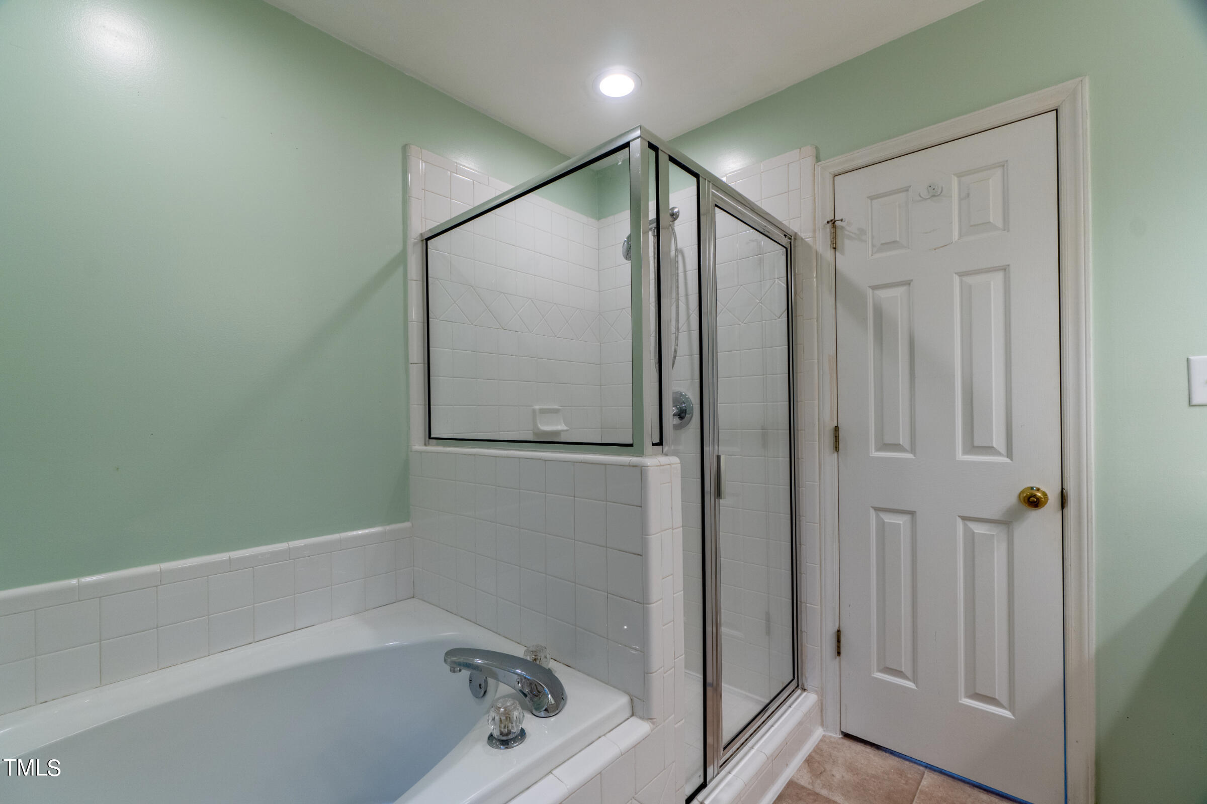 2 Summer Ridge Durham, NC 27712 - Photo 18 of 29 a bathroom with a bathtub and a shower