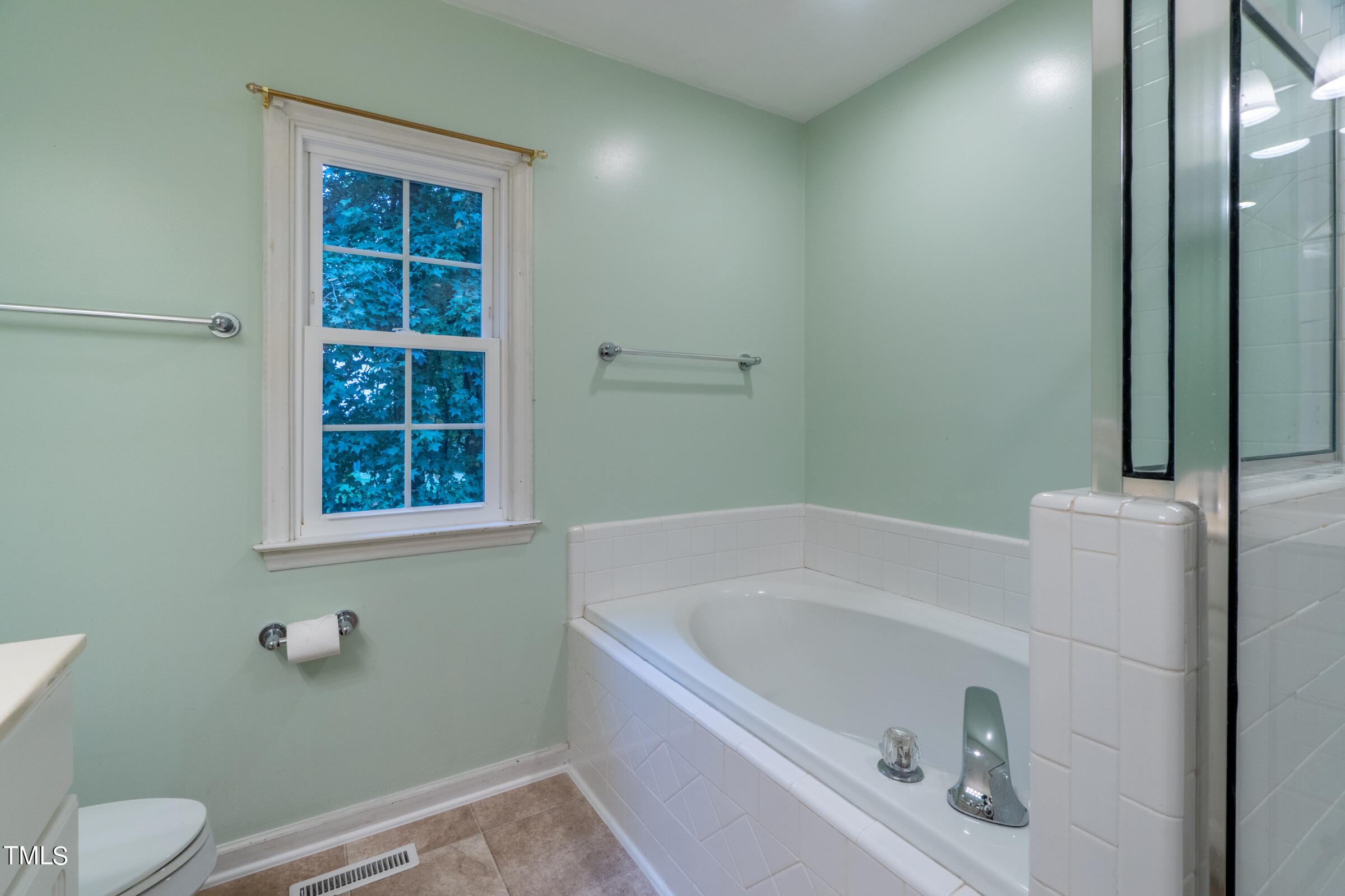 2 Summer Ridge Durham, NC 27712 - Photo 19 of 29 a bathroom with a bathtub and window