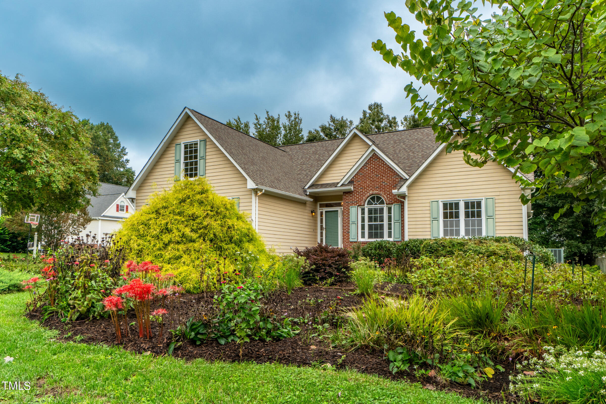 2 Summer Ridge Durham, NC 27712 - Photo 2 of 29 a view of a house with a yard and garden