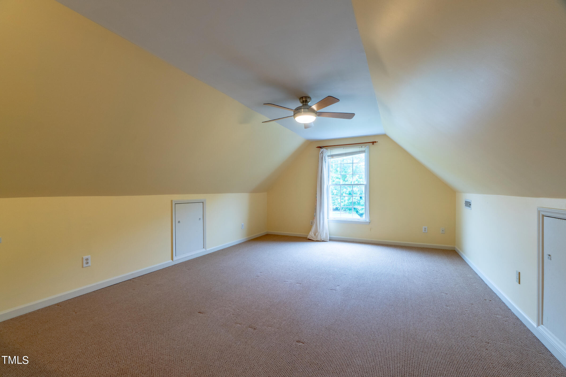 2 Summer Ridge Durham, NC 27712 - Photo 23 of 29 an empty room with windows and chandelier fan