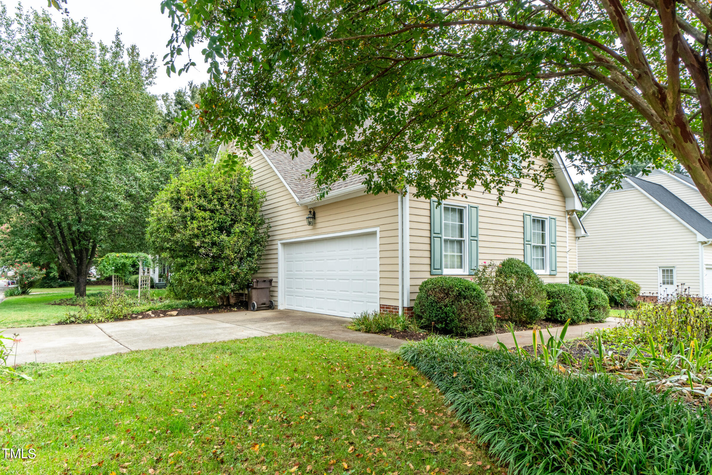 2 Summer Ridge Durham, NC 27712 - Photo 27 of 29 a front view of a house with garden