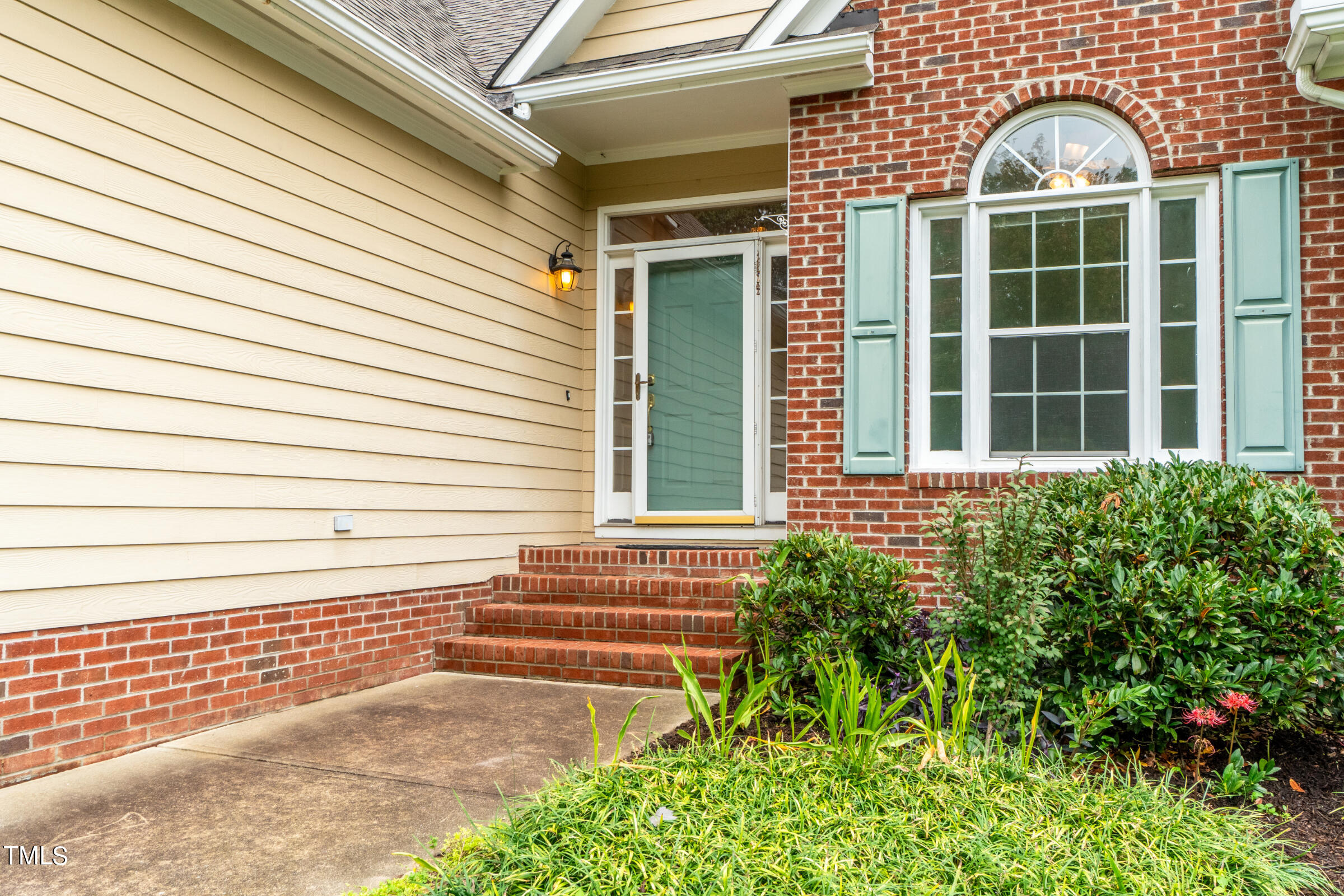 2 Summer Ridge Durham, NC 27712 - Photo 3 of 29 a view of a brick house with a large windows