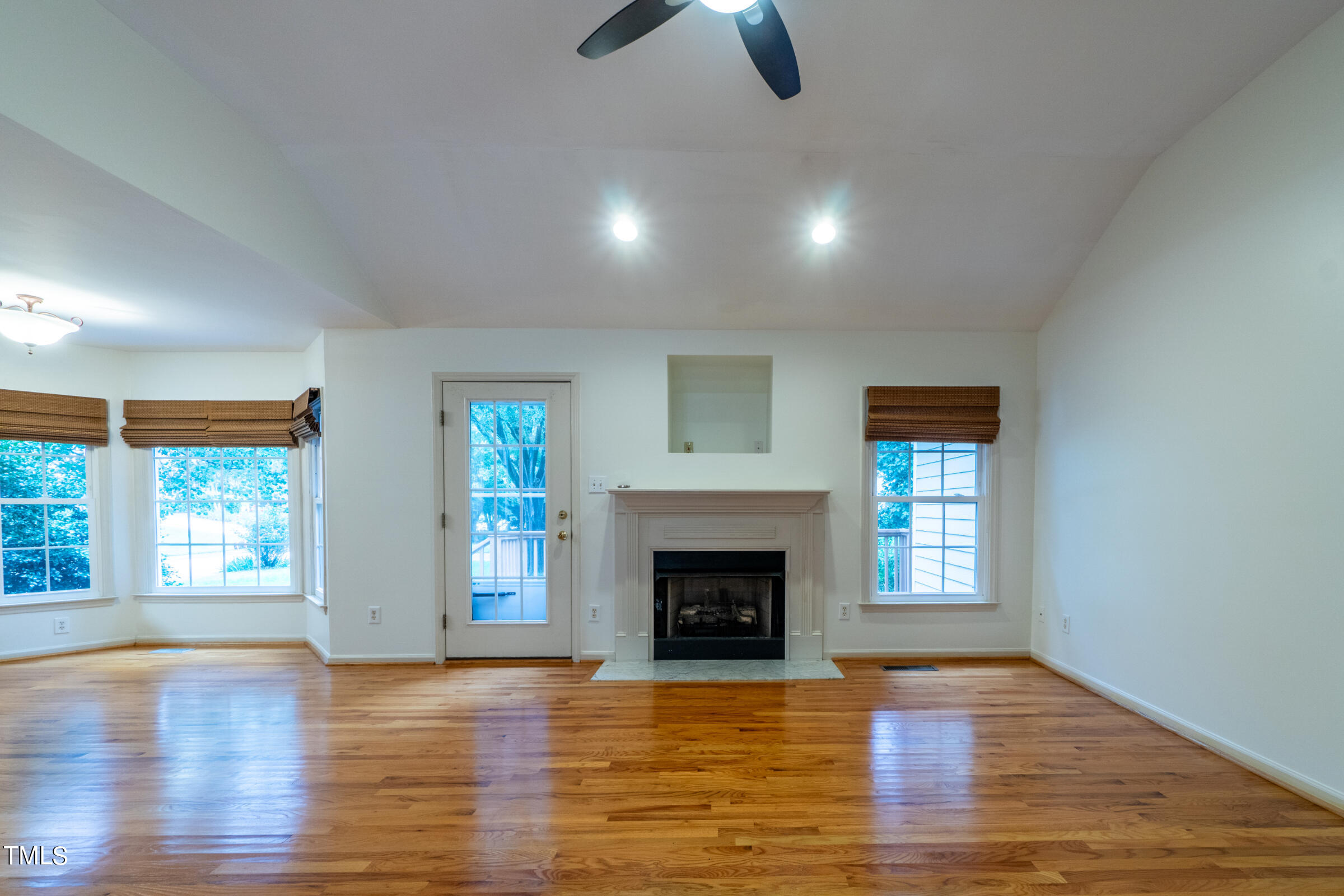 2 Summer Ridge Durham, NC 27712 - Photo 4 of 29 a view of an empty room with window and wooden floor