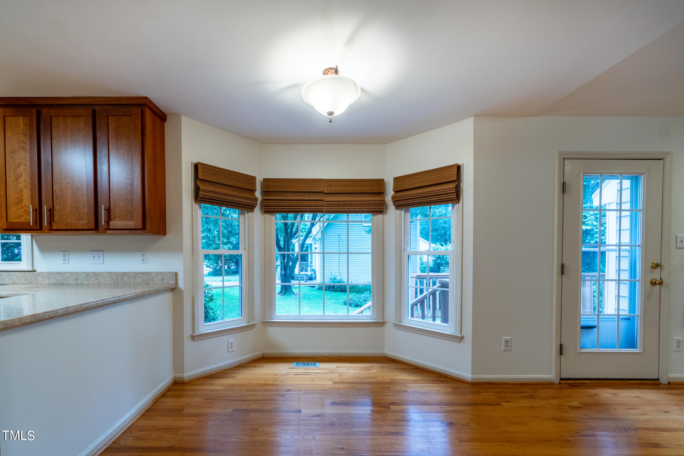 2 Summer Ridge Durham, NC 27712 - Photo 8 of 29 a view of an empty room with window and wooden floor