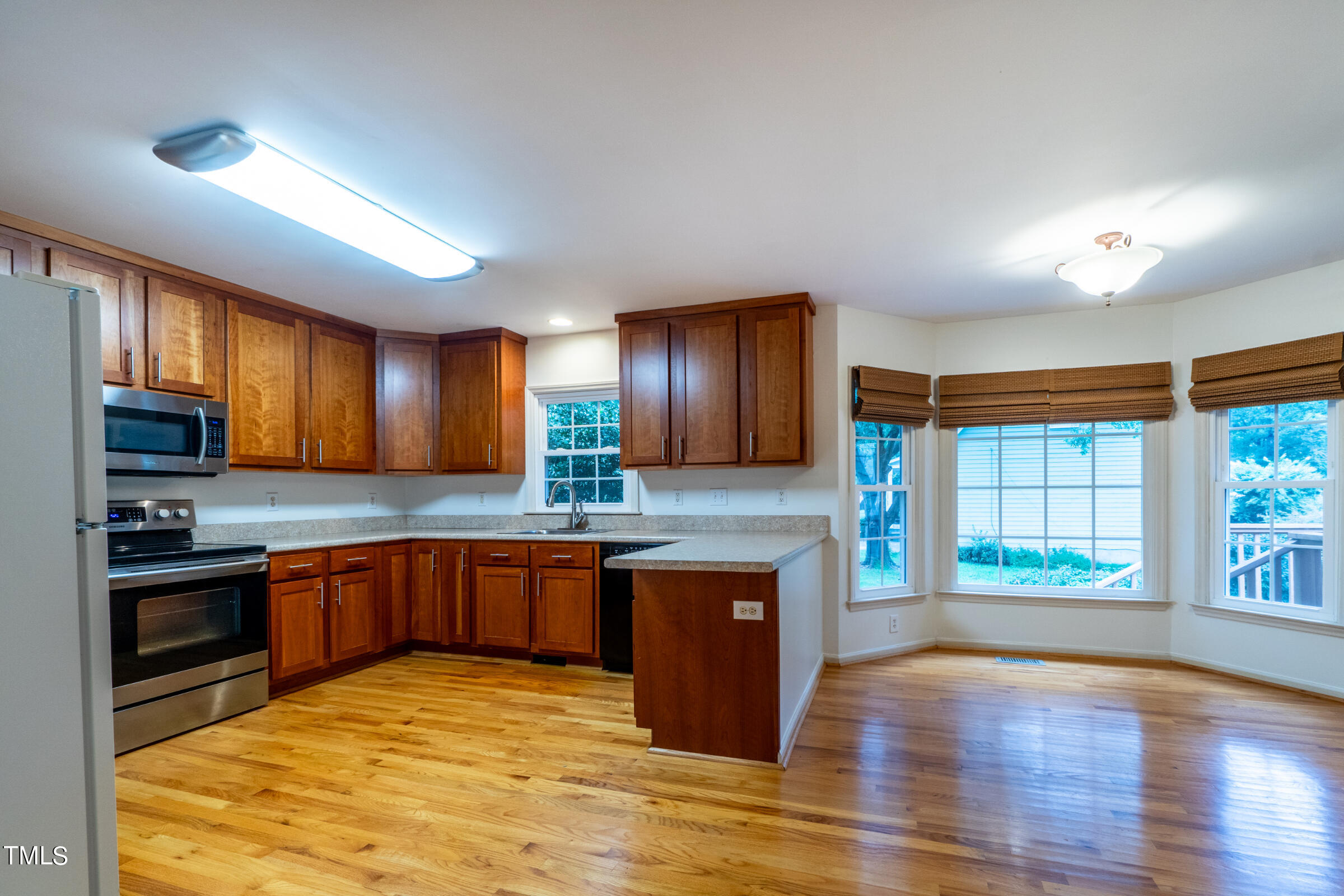 2 Summer Ridge Durham, NC 27712 - Photo 9 of 29 a kitchen with stainless steel appliances granite countertop a stove and a sink
