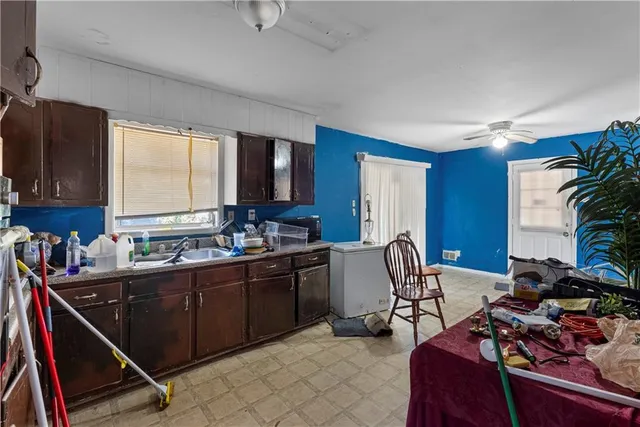 a kitchen with a sink stove and microwave