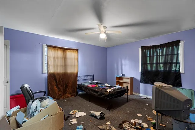 a room with furniture a rug and a window