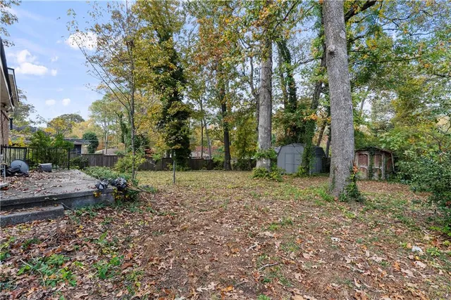 a living room with furniture a flat screen tv and a window