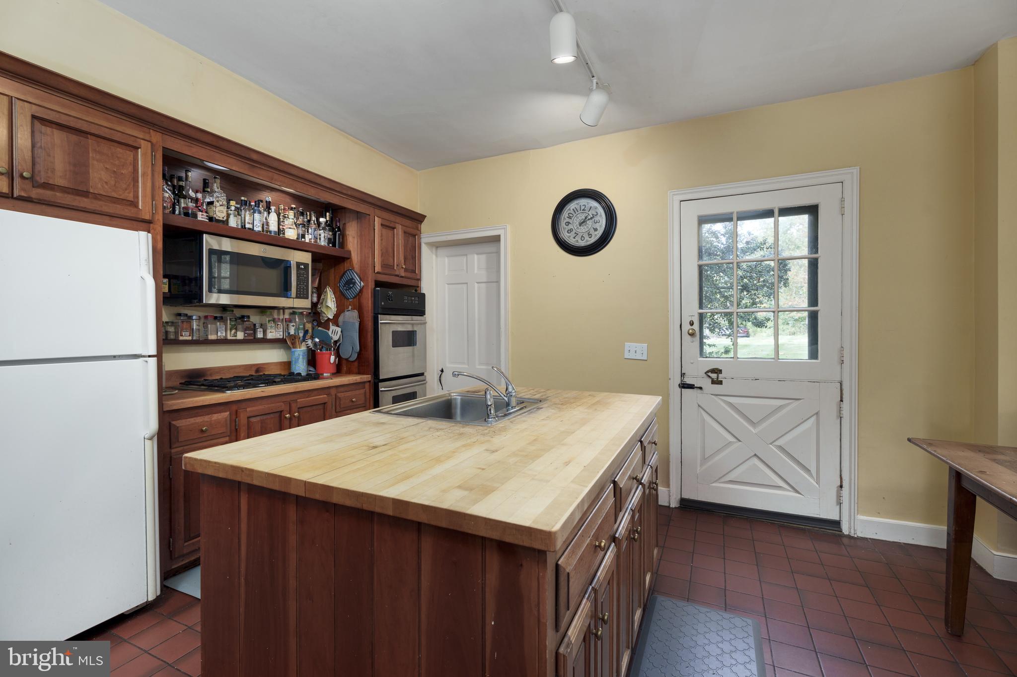 3301 Lawrenceville Road Princeton, NJ 08540 - Photo 23 of 47 A center island with a prep pantry beyond.