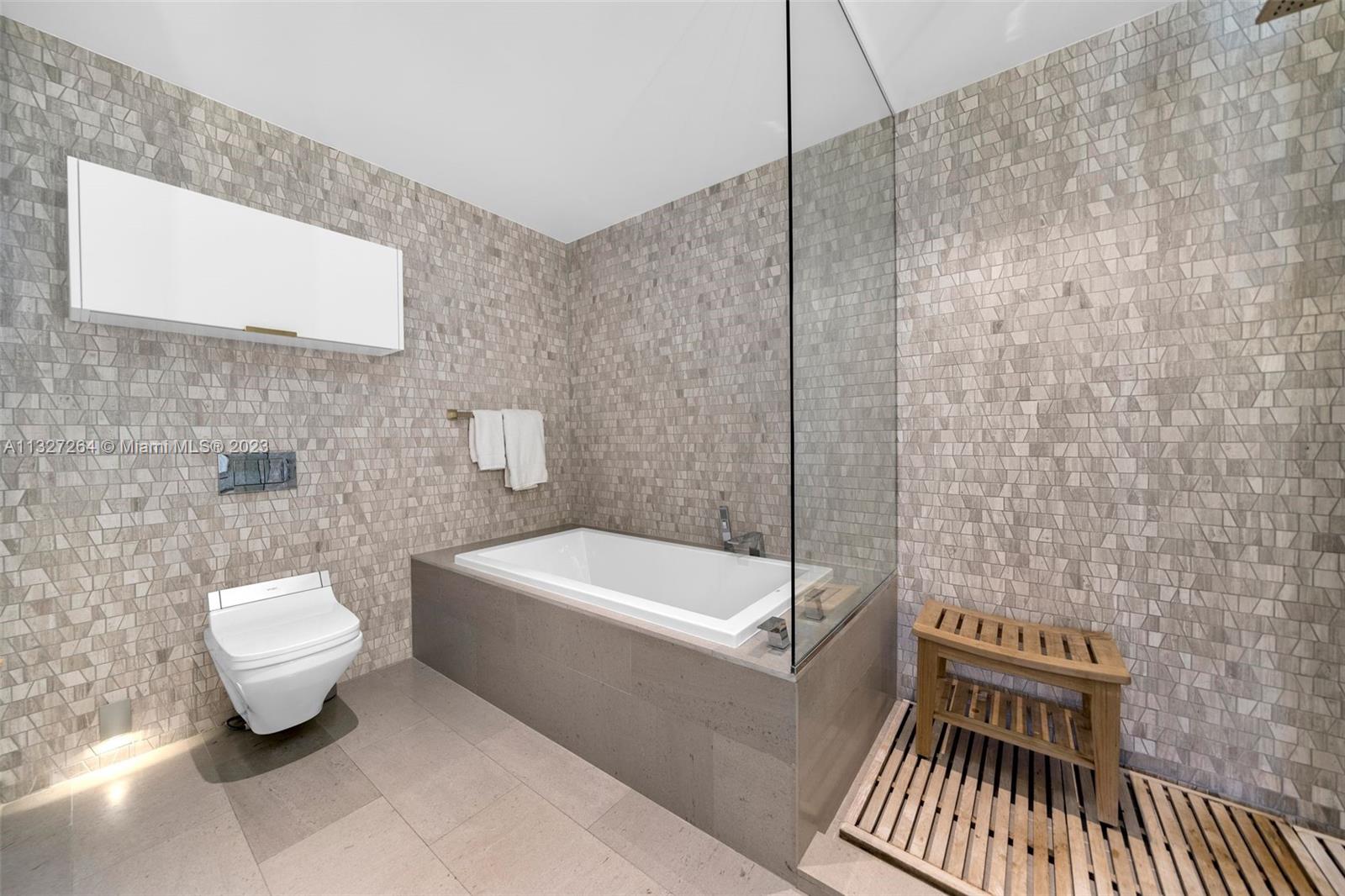 88 Southwest 7th Street, Unit 1212 Miami, FL 33130 - Photo 15 of 45 a bathroom with a sink a toilet and bathtub