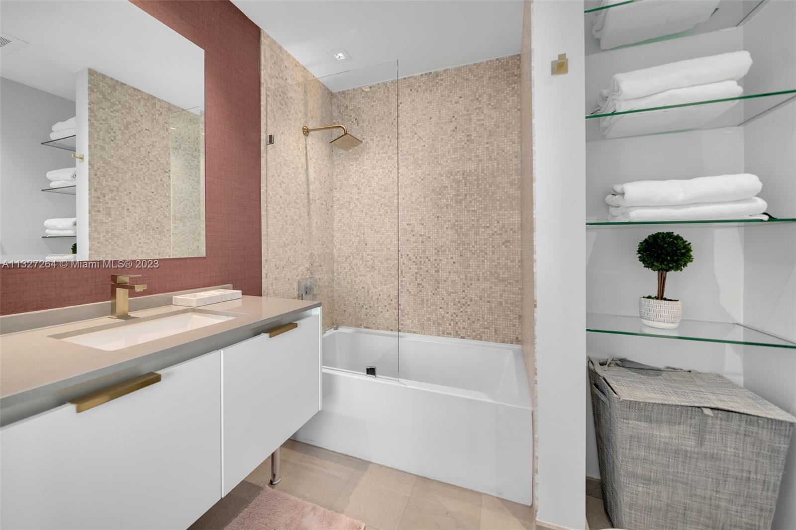 88 Southwest 7th Street, Unit 1212 Miami, FL 33130 - Photo 22 of 45 a bathroom with a bathtub and a sink