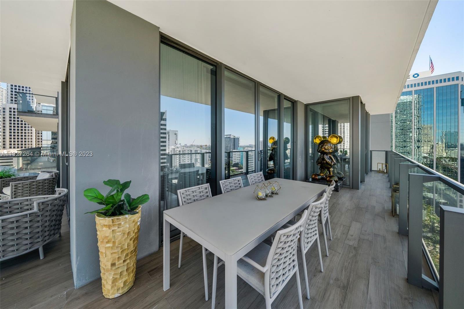 88 Southwest 7th Street, Unit 1212 Miami, FL 33130 - Photo 30 of 45 a view of a dining room with furniture window and wooden floor