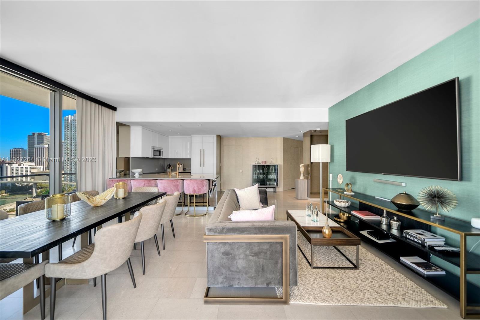 88 Southwest 7th Street, Unit 1212 Miami, FL 33130 - Photo 4 of 45 a living room with furniture and a flat screen tv